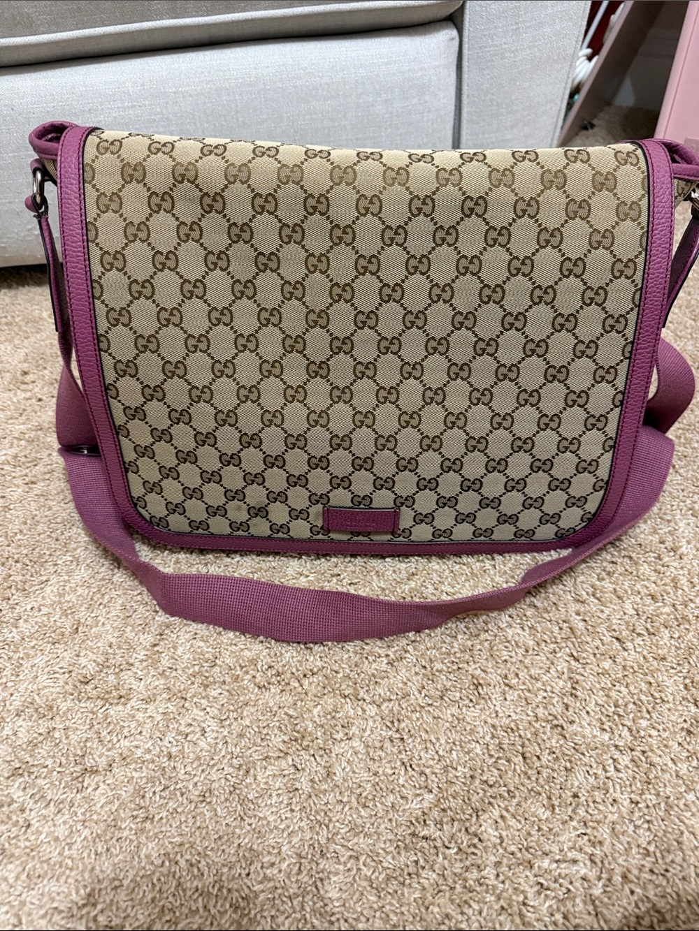 Gucci Beige Monogram Crossbody Diaper bag with Pink Trim.
